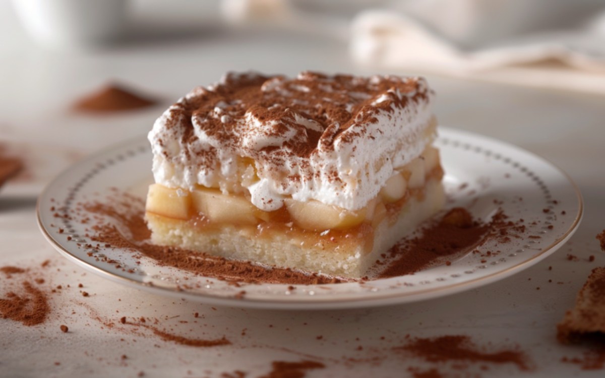 An apple pudding cake bar on a plate.